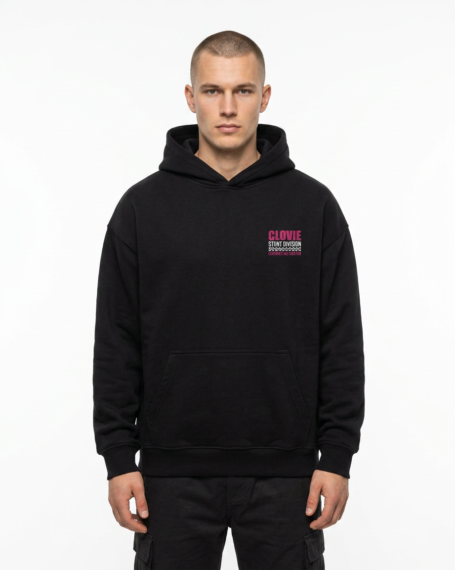 Official Stunt Instructor Oversized Hoodie — Front view mit kleinem CLOVIE Stunt Division Brust-Print