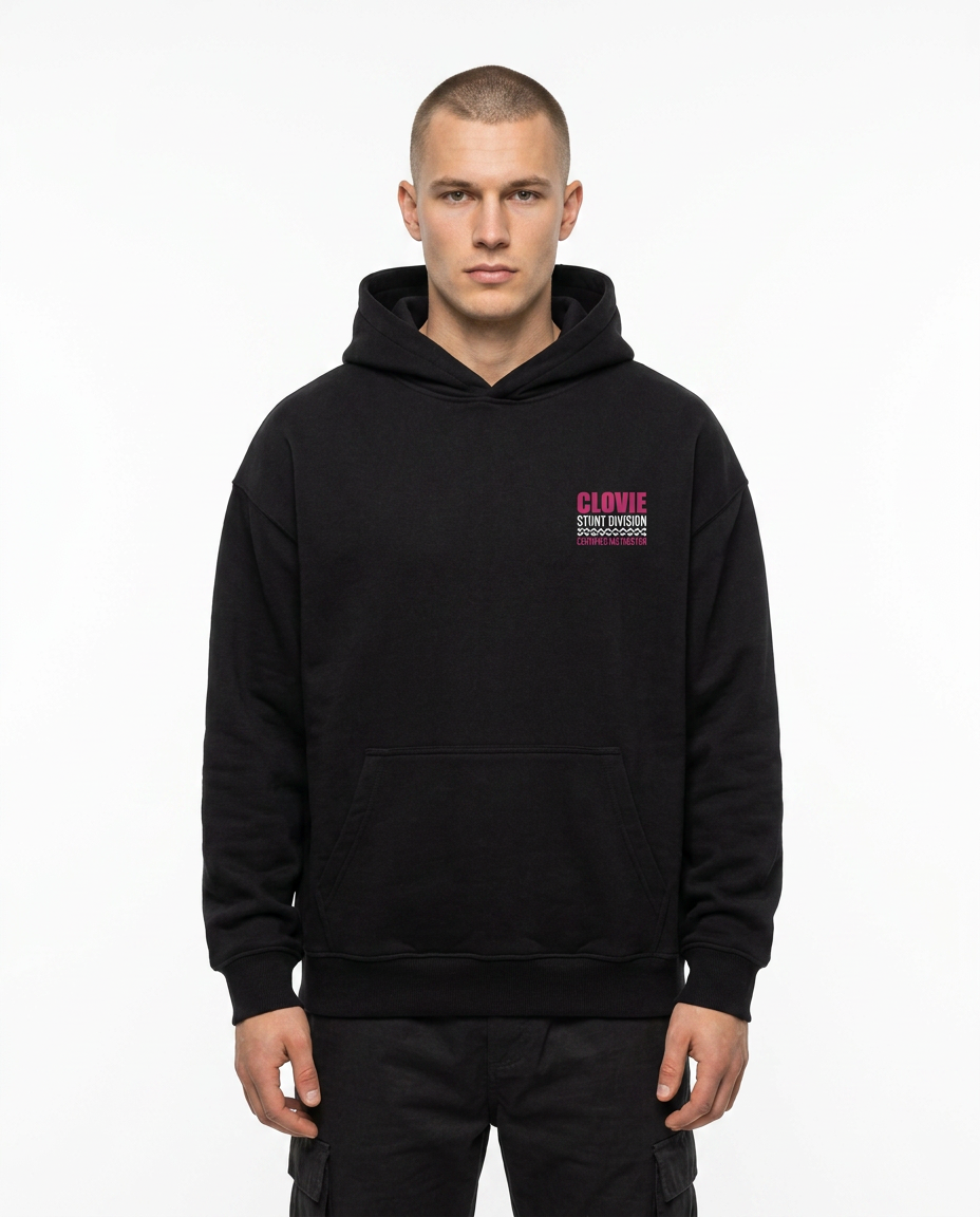 Official Stunt Instructor Oversized Hoodie — Front view mit kleinem CLOVIE Stunt Division Brust-Print