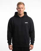 We´re here - Oversized Hoodie - Black - model front print
