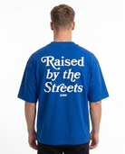 Raised by the streets OVS Tee Cobalt Blue - model back print (new edit-render aus Black-Back)