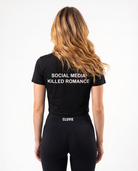 Social media killed romance Cropped Tee Black - female model back print